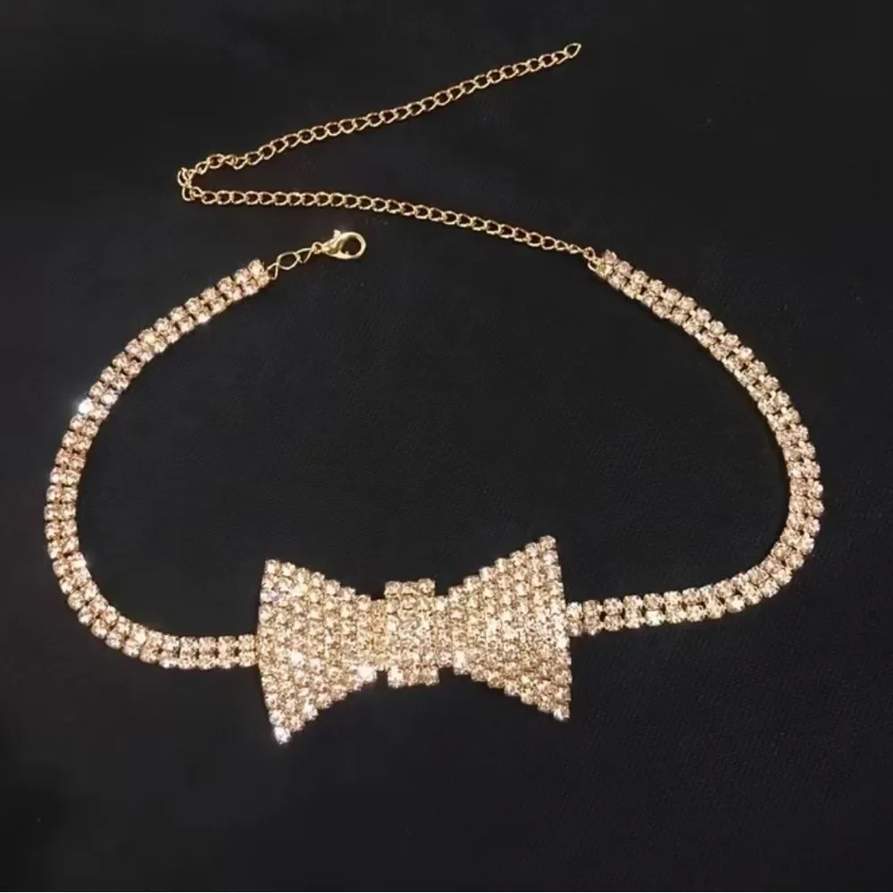Dazzling crystal bow centerpiece on a sparkling choker. Elegant, eye-catching.